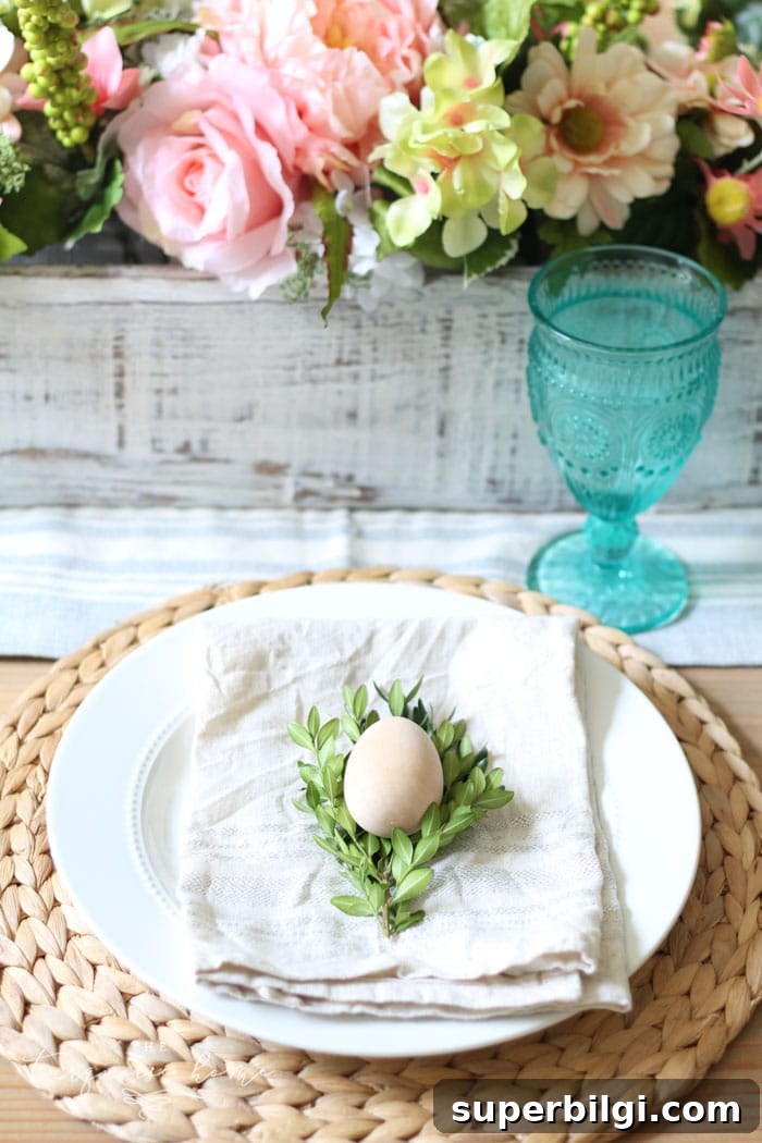 Spring Tablescape and Entryway Decor Ideas 3 Turquoise goblets and farmhouse table details with pink jars and wooden eggs