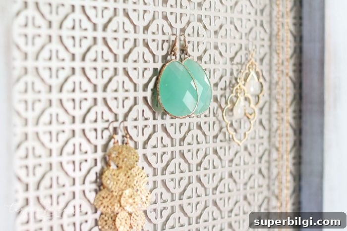 How to Build a Stylish DIY Industrial Jewelry Organizer 5 Close-up of mosaic metal sheet used as backing for jewelry organizer