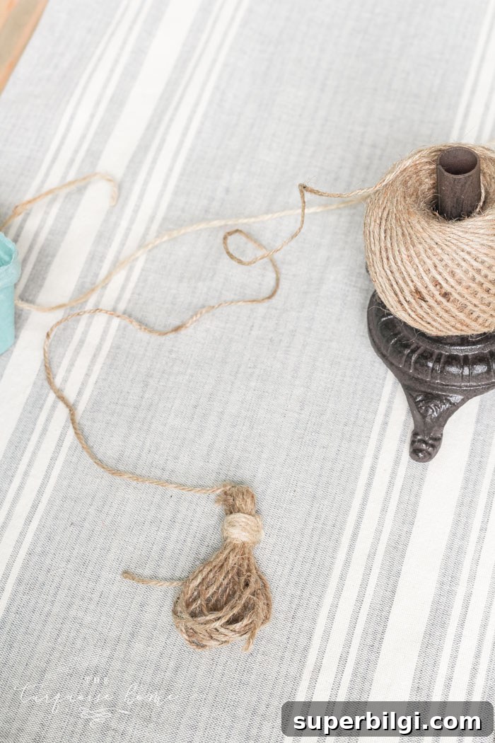 Super cute DIY Wood Bead Garland with Tassels is so easy and fun to make! Cheap, too!!