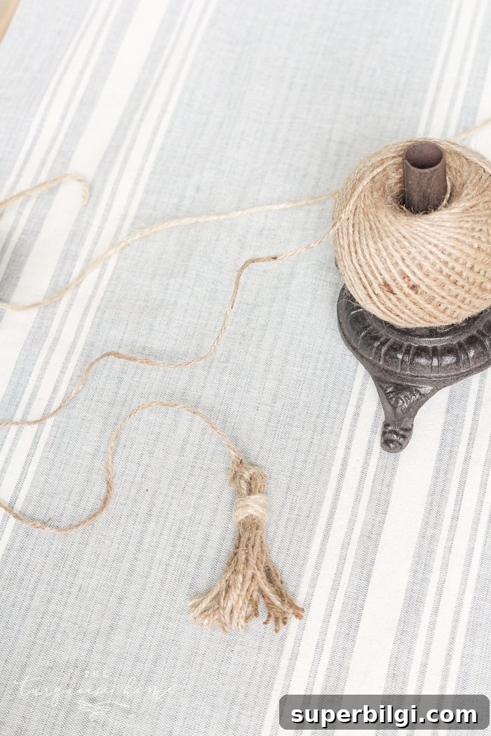 Super cute DIY Wood Bead Garland with Tassels is so easy and fun to make! Cheap, too!!