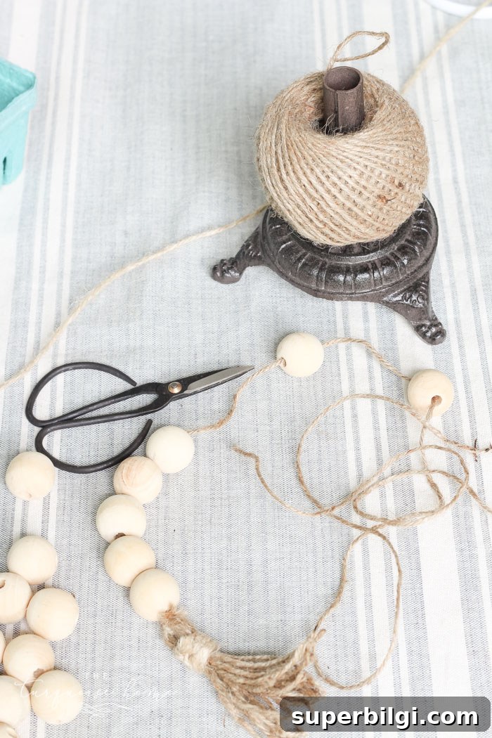 Super cute DIY Wood Bead Garland with Tassels is so easy and fun to make! Cheap, too!!