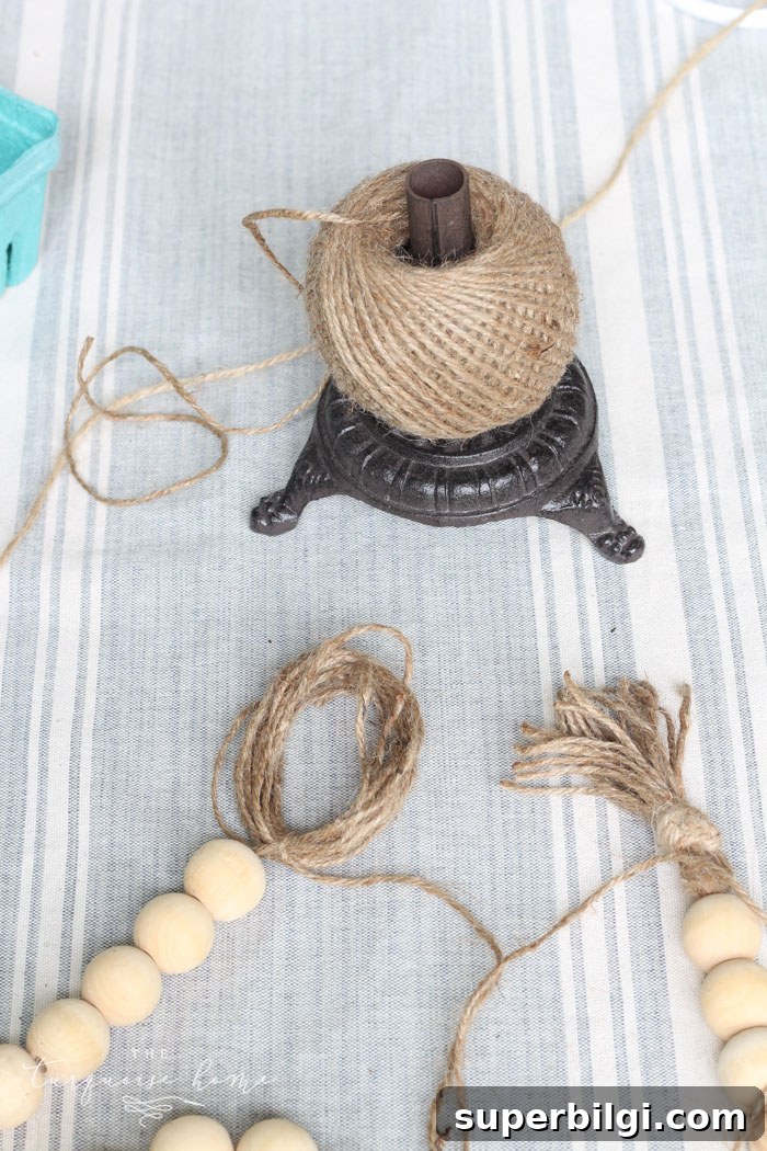 Super cute DIY Wood Bead Garland with Tassels is so easy and fun to make! Cheap, too!!