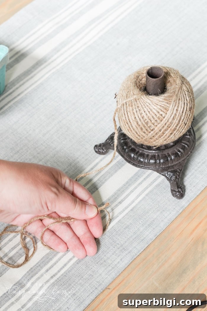 Super cute DIY Wood Bead Garland with Tassels is so easy and fun to make! Cheap, too!!