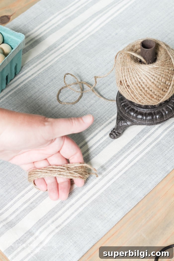 Super cute DIY Wood Bead Garland with Tassels is so easy and fun to make! Cheap, too!!