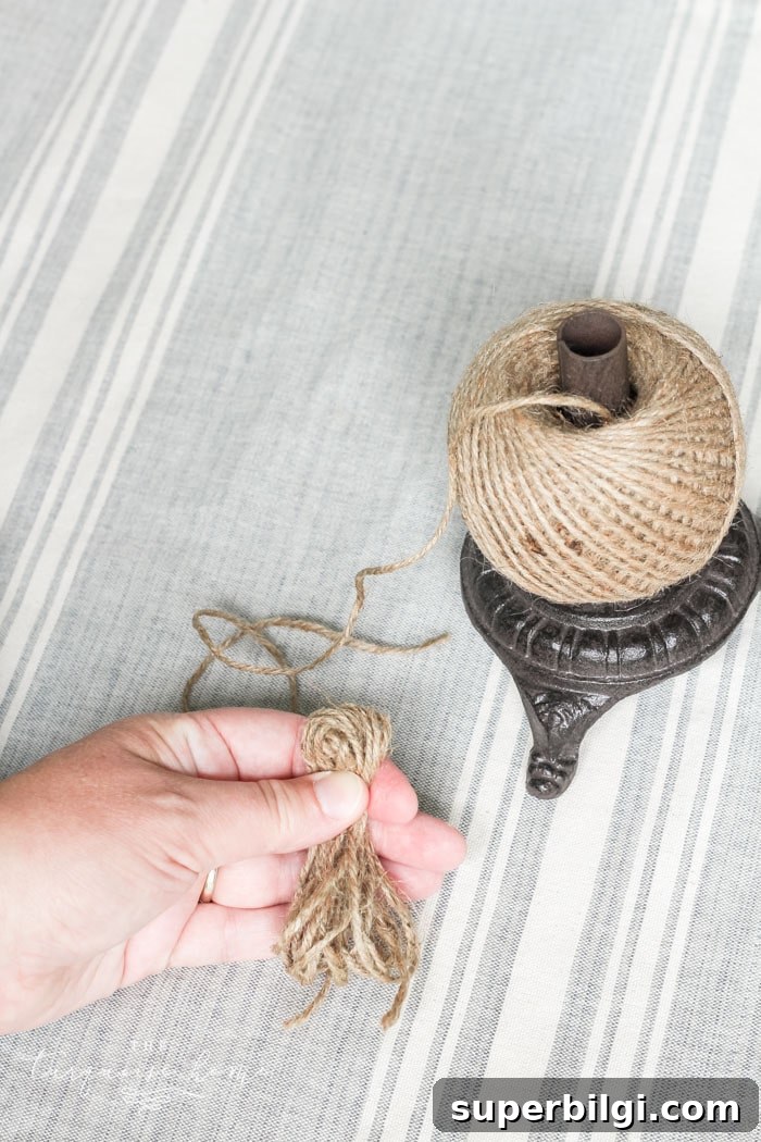 Super cute DIY Wood Bead Garland with Tassels is so easy and fun to make! Cheap, too!!