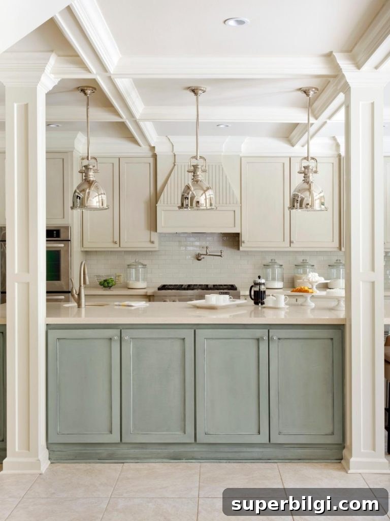 A Distressed Duck Egg Blue kitchen Island with shiny stainless steel pendant lights.