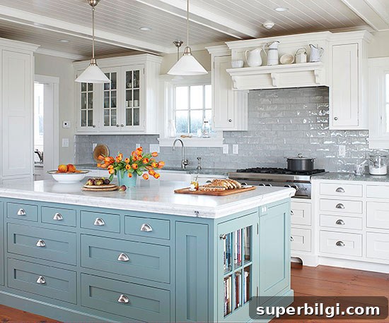 A Cornflower Blue kitchen Island with white outer cabinets.