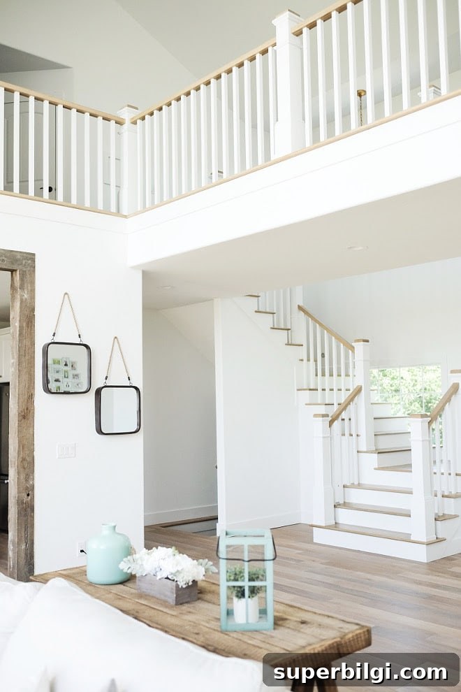 White Paint Color Ideas for Every Room in Your Home 6 Extra White Paint Color from Sherwin Williams in a staircase landing space