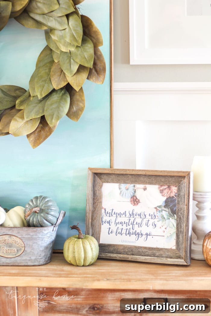 Love this #fixerupper style! Fall console table and gallery wall with tiered farmhouse stand and magnolia wreath