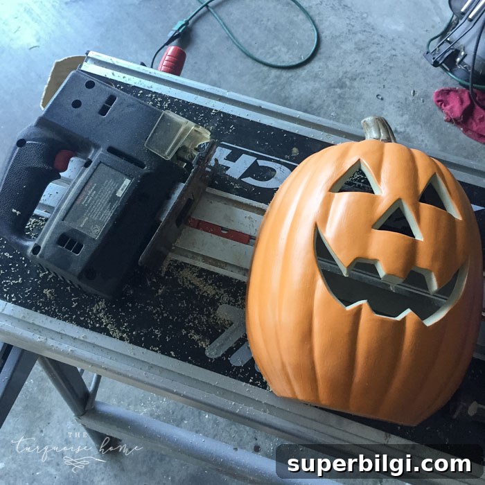 DIY Lighted Pumpkin Candy Holder: Halloween Decor 10 Cut the pumpkin in half for the DIY Lighted Pumpkin Candy Holder