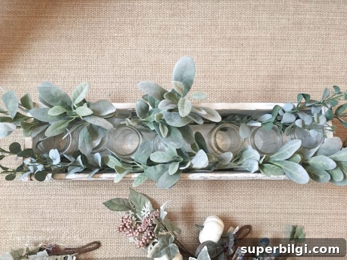 Create a Stunning Faux Foliage Table Centerpiece 5 Mason jars in wooden box for centerpiece