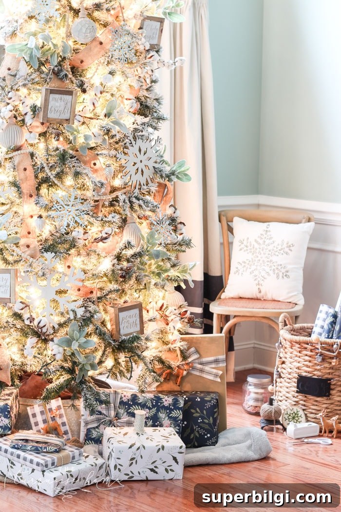 7 Christmas Activities to Spark Holiday Cheer + Free Printables 4 My Flocked Farmhouse Christmas Tree - super cute cotton stems, lamb's ear, galvanized snowflakes, and wooden bead garland.