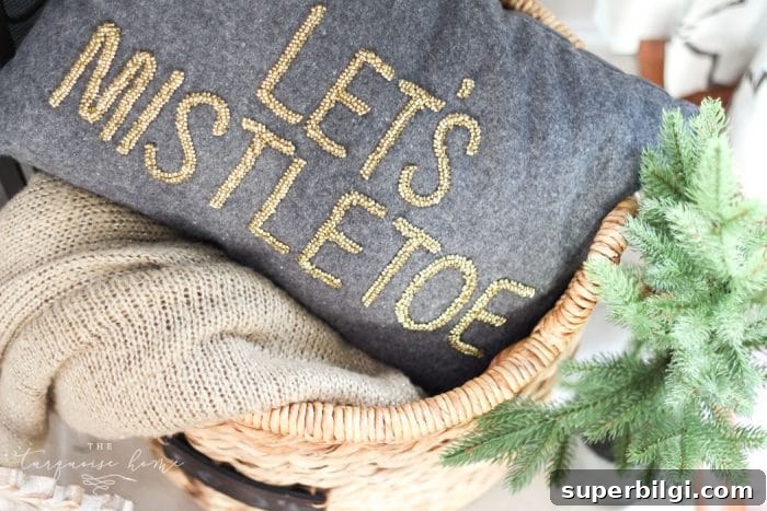 Farm-Fresh Christmas Tree Mantel Ideas 6 Let's Mistletoe pillow from Target is the cutest way to get into the Christmas mood!