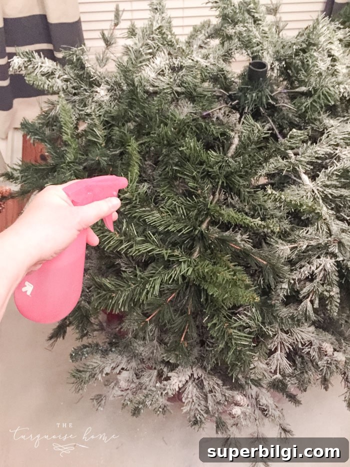 How to Flock a Christmas Tree: DIY Snowy Tree Tutorial 7 Mist each section lightly before adding flocking powder.