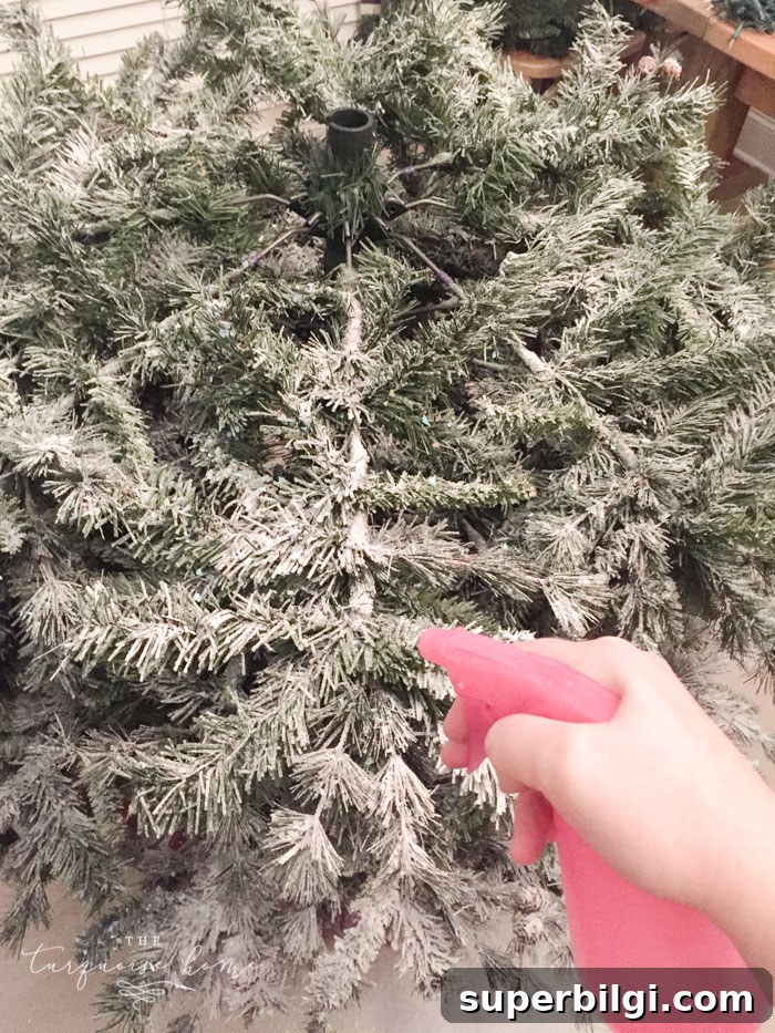 How to Flock a Christmas Tree: DIY Snowy Tree Tutorial 9 Mist again to set the flocking for a natural look.