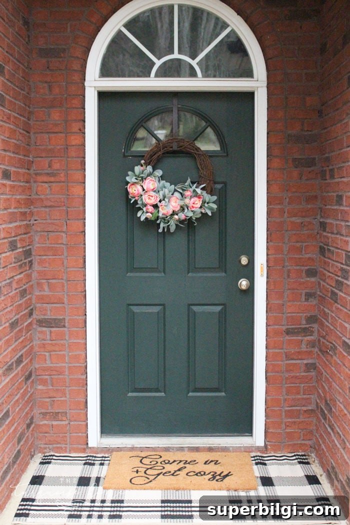 Cheerful Spring Doormats to Brighten Your Entryway 3 Front door with layered doormats and DIY peonies spring wreath!