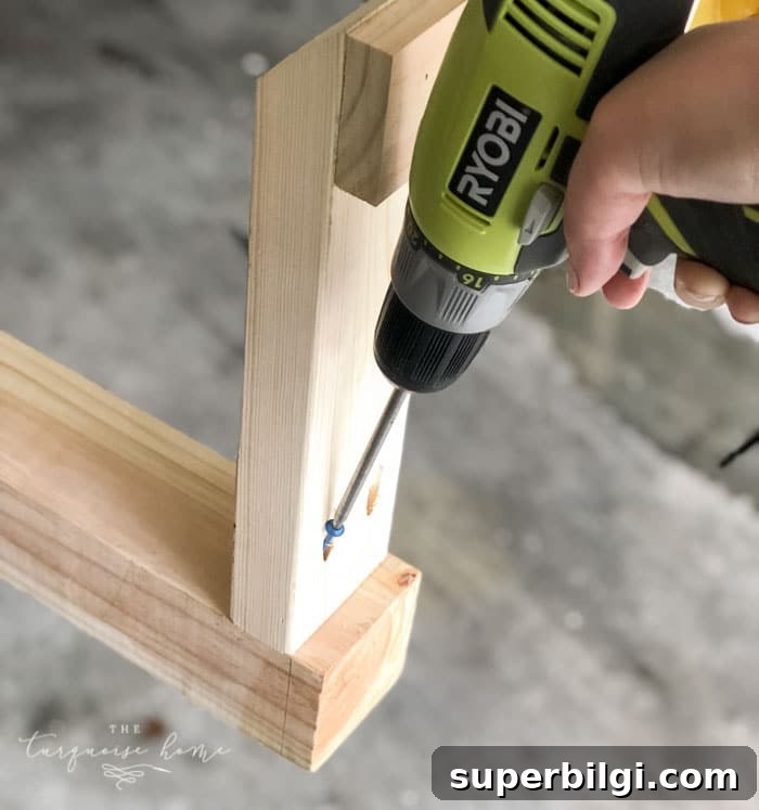 DIY Wooden Coat Rack: Step-by-Step Build Guide 9 Add the legs to the end of the post with Kreg Jig Screws! #buildyourownathome #diyproject #diy #buildlikeagirl