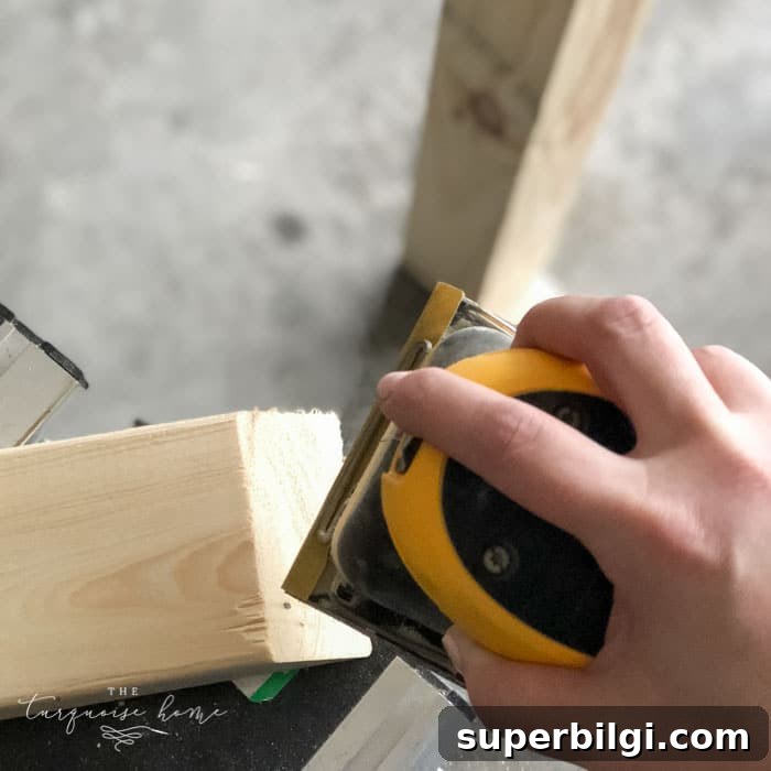 DIY Wooden Coat Rack: Step-by-Step Build Guide 12 Sand down the whole DIY Coat Rack to make sure there are no splinters or rough spots! Then wipe down with a damp cloth. | Standing Coat Rack | #buildyourownathome #diyproject #diy #buildlikeagirl
