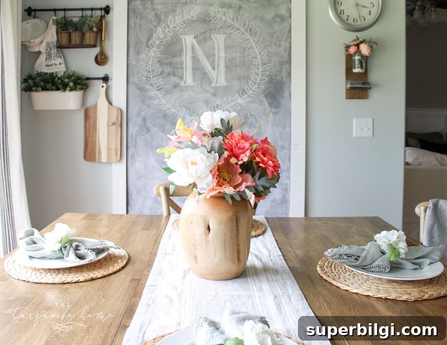 Beautiful teak vase and simple place settings make the perfect addition to the before and after kitchen makeover!