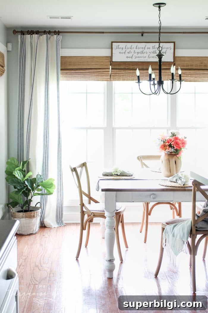 Gorgeous new bamboo shades and striped curtains make an impact in DIY kitchen makeovers!