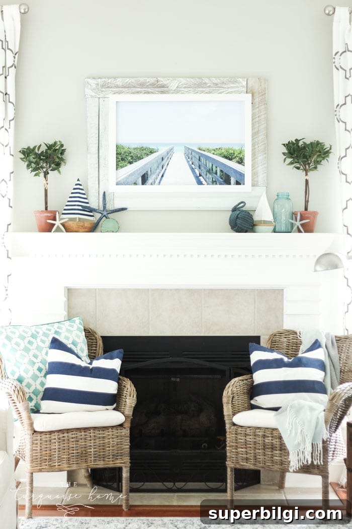 Coastal Summer Mantel Decor Ideas to Refresh Your Space 3 A coastal summer mantel decor ideas. Add a little nautical charm to your living space with these simple coastal summer mantel decor ideas. Featuring DIY beach canvas art, blue & white starfish, textured sailor's knot and cheerfully striped sail boats, this mantel looks great for the seasonally inspired.