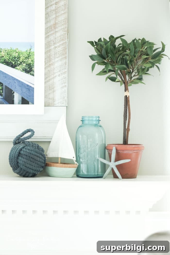 Coastal Summer Mantel Decor Ideas to Refresh Your Space 8 Add a little nautical charm to your living space with these simple coastal summer mantel decor ideas. Featuring DIY beach canvas art, blue & white starfish, textured sailor's knot and cheerfully striped sail boats, this mantel looks great for the seasonally inspired.
