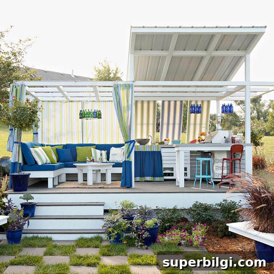 Stunning and Practical Outdoor Living Space Designs 8 Outdoor kitchen with sitting area and colorful textiles