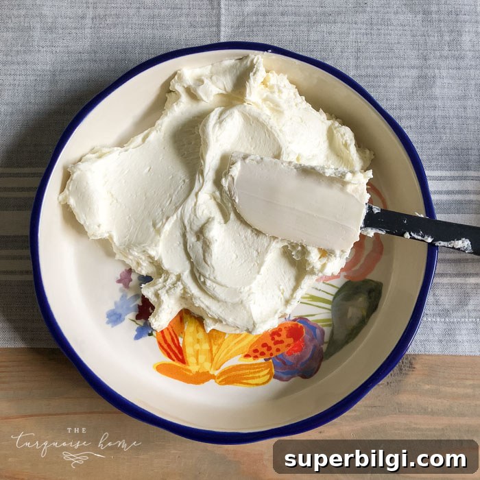 Cream Cheese Caramel Apple Dip Recipe 5 Spread the cream cheese and sugar mixture in the bottom of your pretty serving dish. | Cream Cheese Caramel Apple Dip Recipe