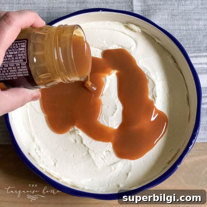 Cream Cheese Caramel Apple Dip Recipe 6 Pour the caramel sauce over the cream cheese spread. | Cream Cheese Caramel Apple Dip Recipe