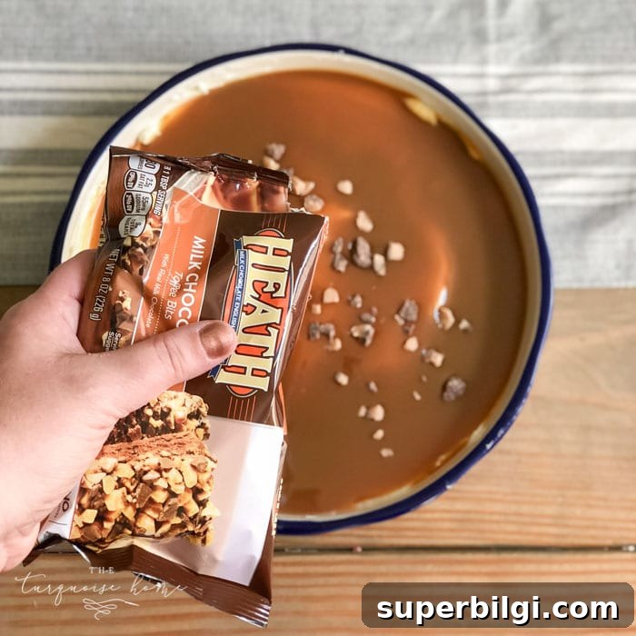Cream Cheese Caramel Apple Dip Recipe 7 Sprinkle the toffee bits on top of the caramel. | Cream Cheese Caramel Apple Dip Recipe