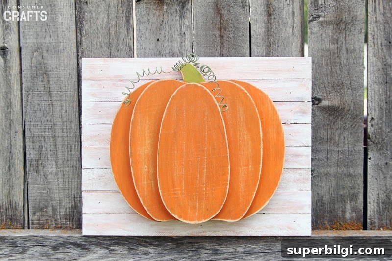 13 Charming Wooden Pumpkins for Fall Decor on Any Budget 6 Oval Wood Plaque Pumpkin