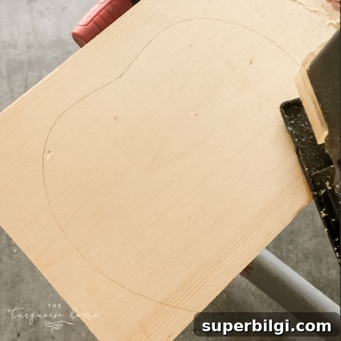 DIY Farmhouse Wooden Pumpkin for Fall Decor 3 Trace the outline of the wooden pumpkin on the board and cut with a jigsaw.