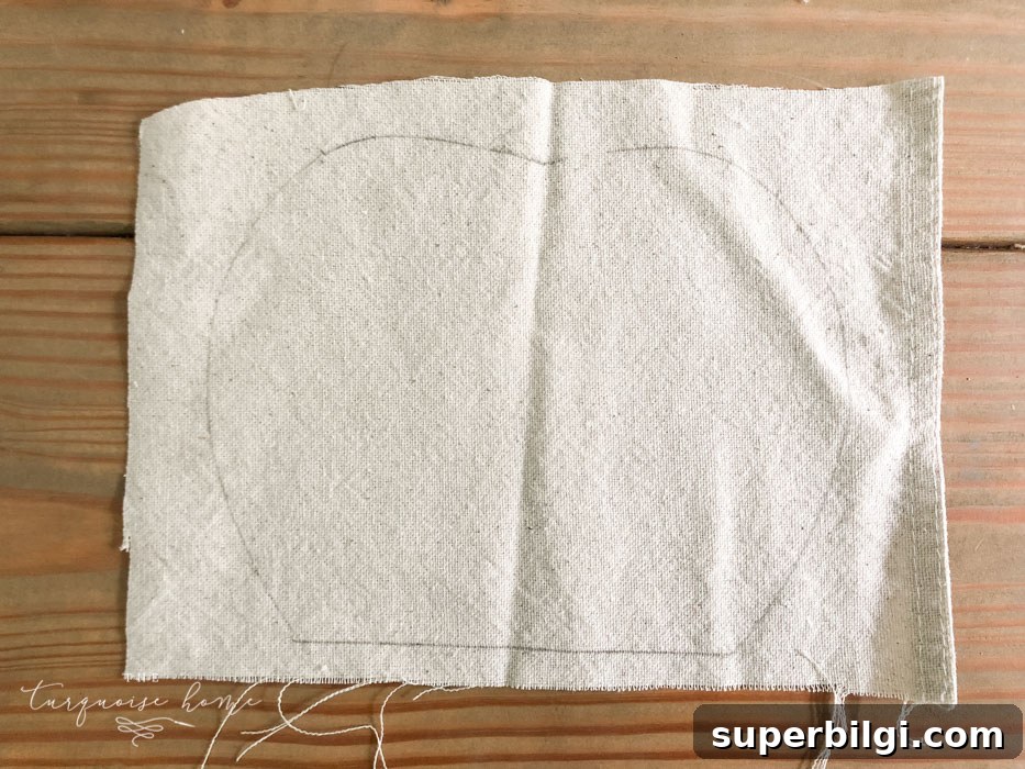 DIY Farmhouse Wooden Pumpkin for Fall Decor 5 Trace the outline of the wooden pumpkin on the cloth.