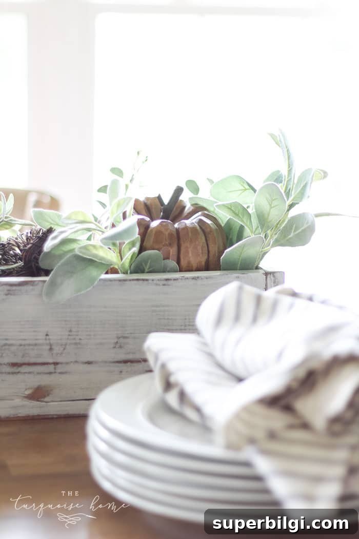 Fall Pumpkin Decor Ideas for Your Kitchen 7 My favorite wooden pumpkin sitting in a bed of lamb's ear leaves. Perfect for a fall centerpiece!