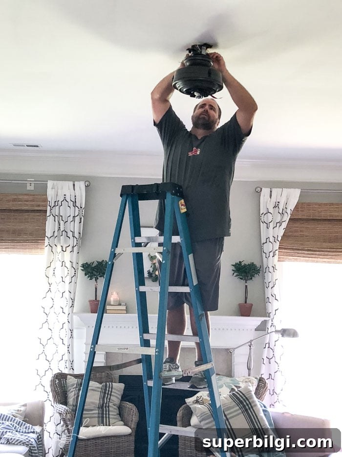 Farmhouse Ceiling Fans That Add Rustic Charm 4 This beautiful farmhouse ceiling fan was the easiest light fixture installation ever!! #farmhouseceilingfan #ceilingfan #farmhouse #joannagaines #theturquoisehome #diyhomedecor