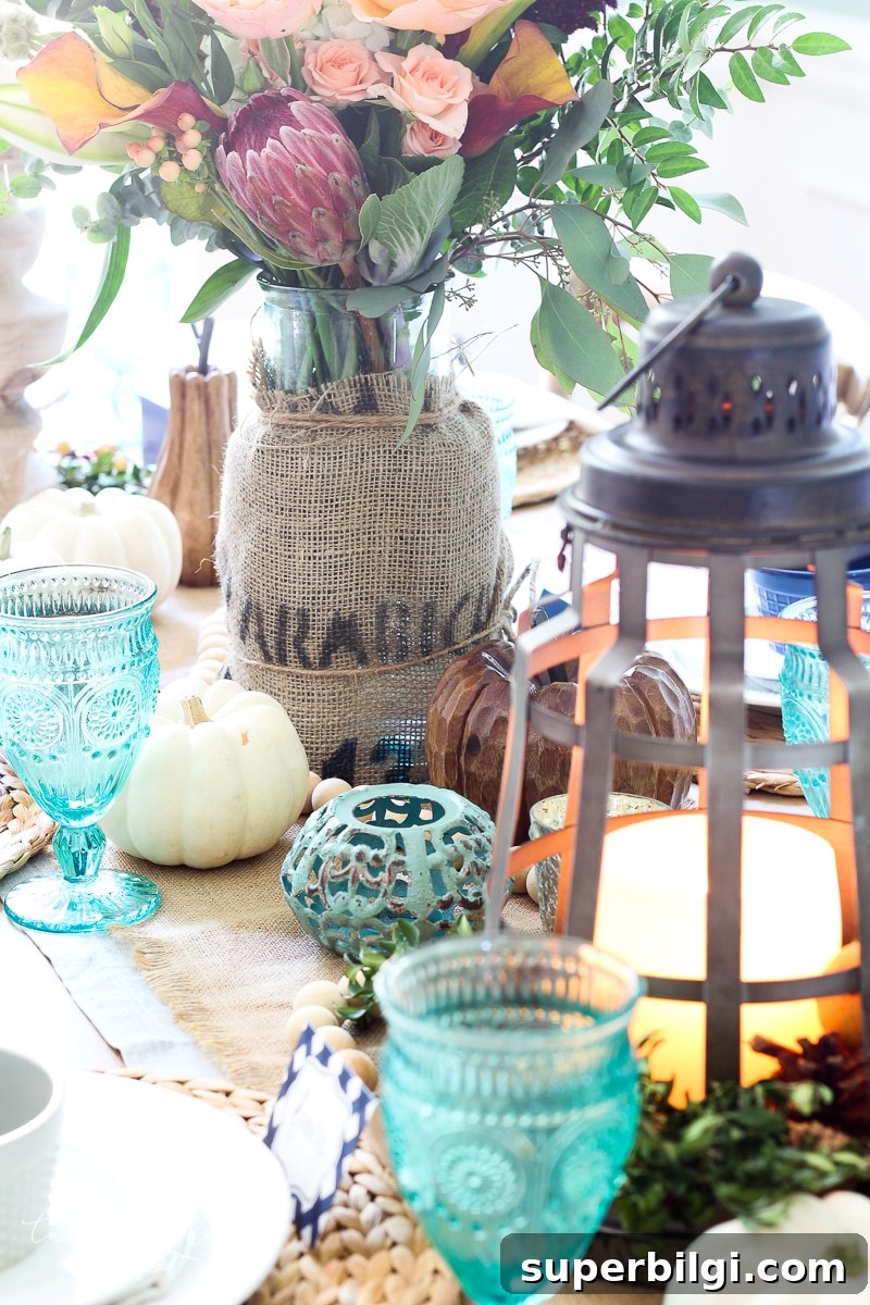 Affordable Fall Decor Ideas for a Cozy Home 8 Lantern, Candles and Farmgirl Flowers Fall Tablescape