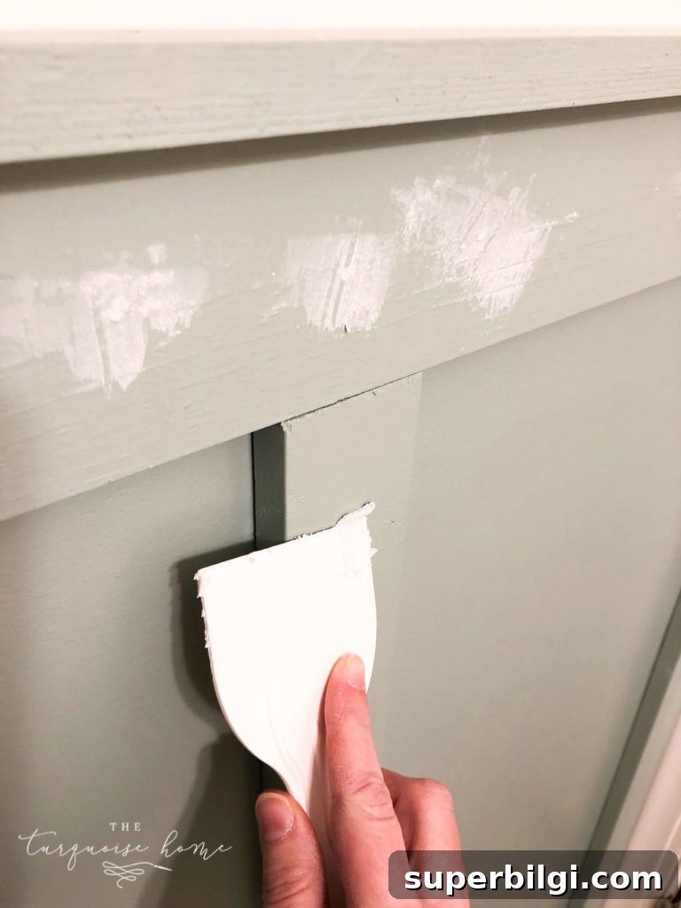 How to Install Board and Batten in a Girls' Bathroom 9 Patch the nail holes
