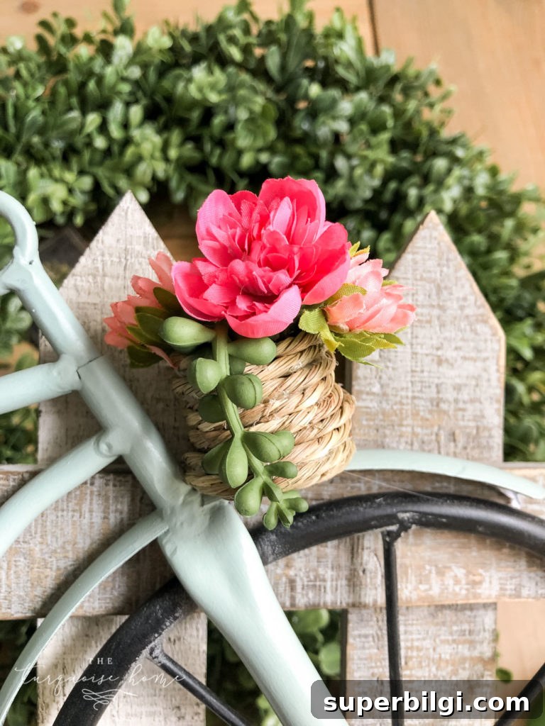 DIY Boxwood Bicycle Wheel Spring Wreath 6 DIY Boxwood and Bicycle Spring Wreath - adding flowers to the basket