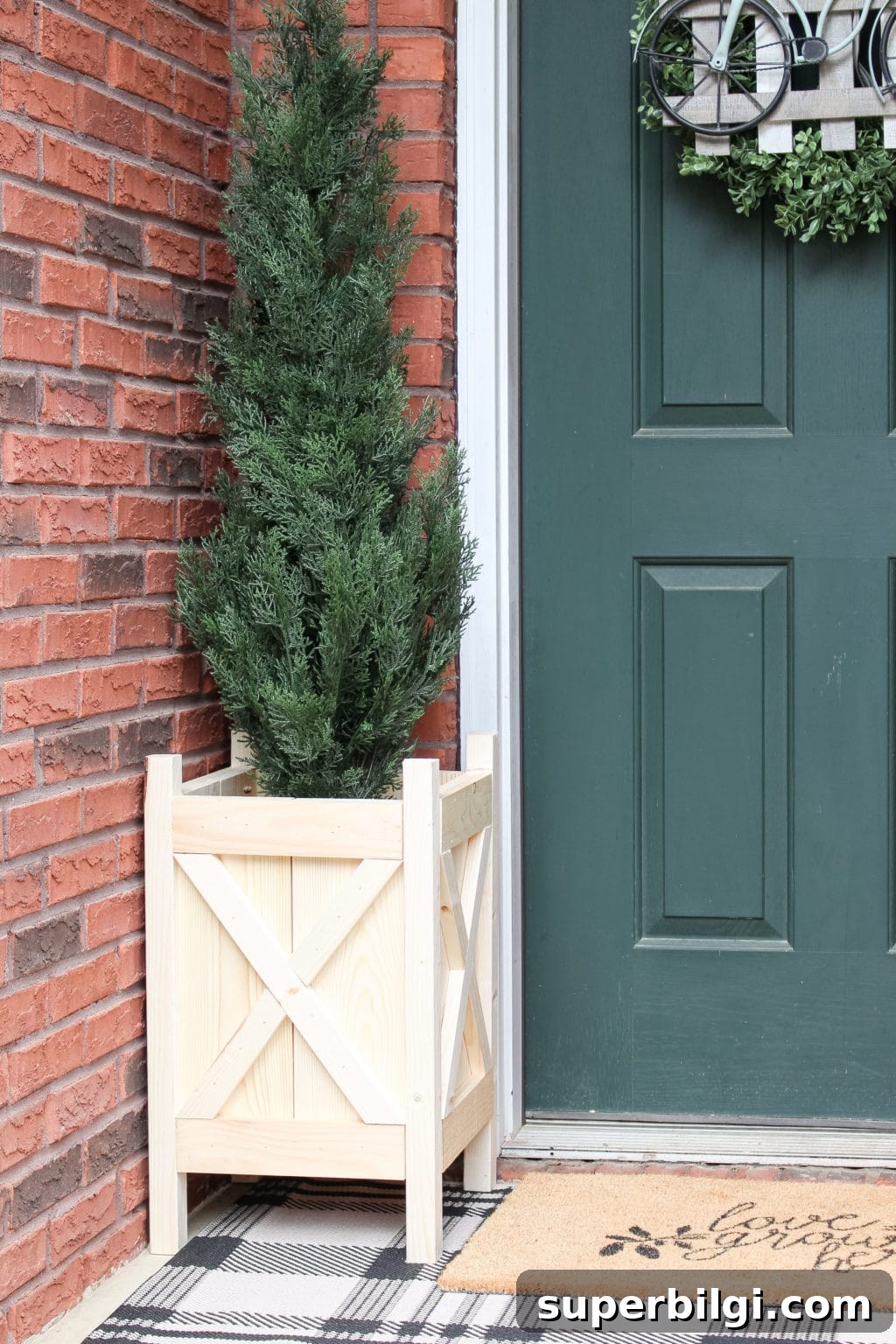 How to Build a Wooden Planter Box Step-by-Step 13 Completed DIY wood planter box on front porch