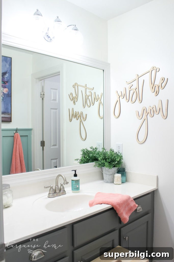 Window arch above the toilet in the girls' bathroom refresh | Use a basket for toilet paper storage and a over-the-toilet cabinet if needed | bathroom makeover