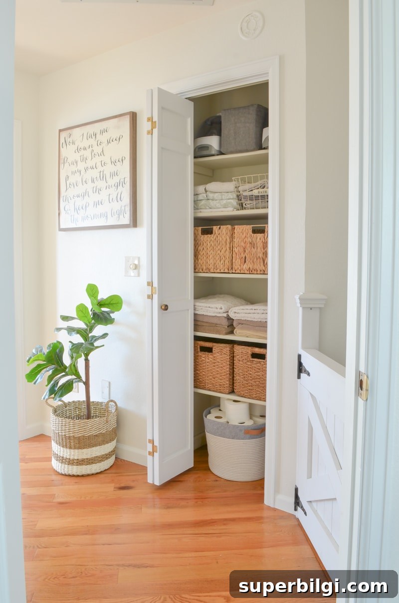 Linen Closet Organization: Smart Storage Tips and Ideas 9 This gorgeous linen closet from Sarah Joy Blog is the perfect combination of storage bins and folded towels with a beautiful bin for corralling toilet paper.