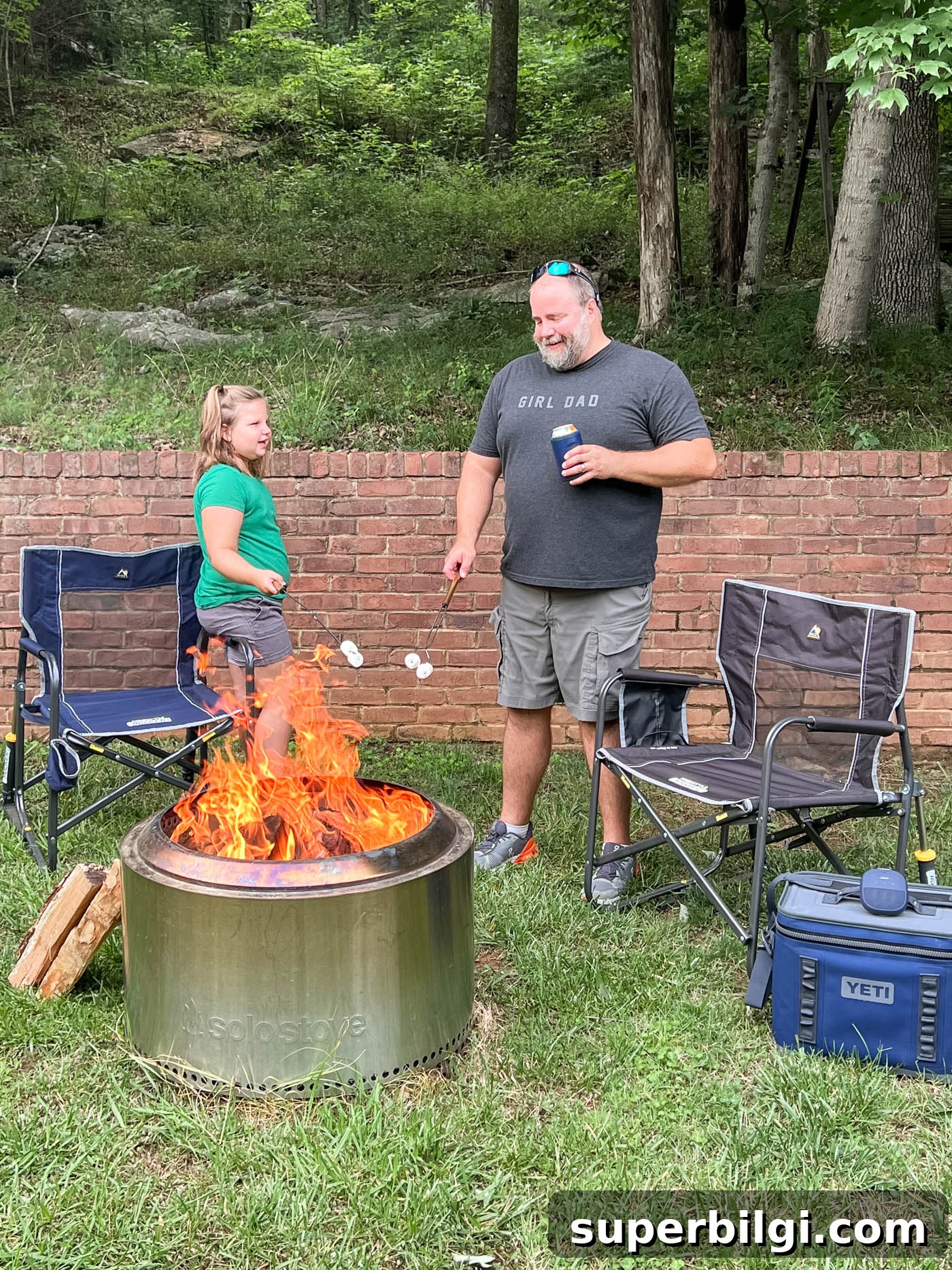 Dad with daughter and bonfire
