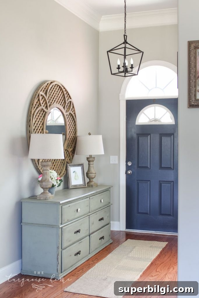 Benjamin Moore Hale Navy: Color Guide and Pairing Ideas 2 Hale Navy Painted Door | Darlana Pendant Lantern Knock-off for the Foyer! LOVE this light for less than $100!!