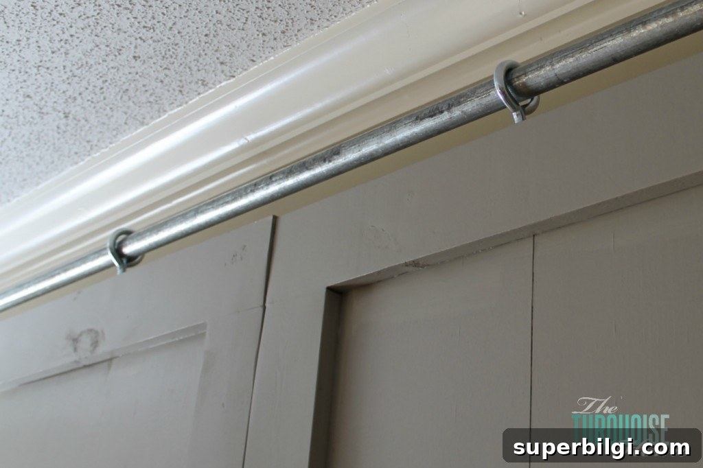DIY Sliding Barn Door: Step-by-Step Build Guide 7 DIY Simple Sliding Barn Doors | TheTurquoiseHome.com