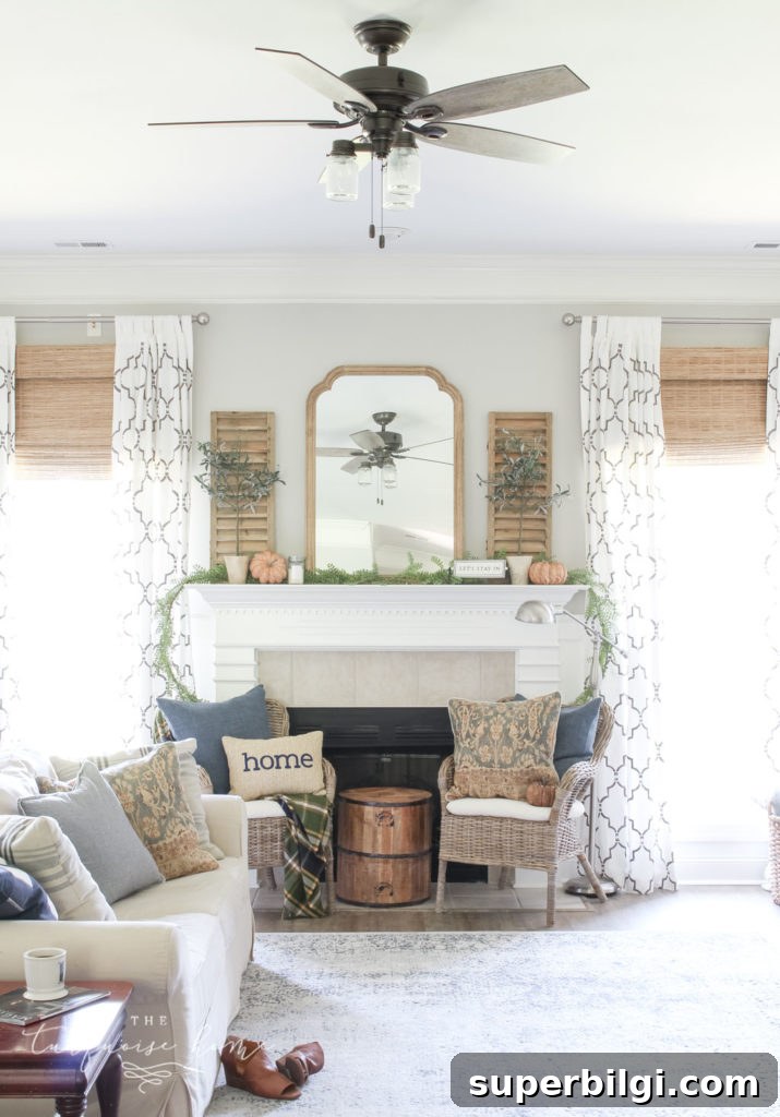 Neutral Fall Mantel Ideas for a Cozy, Timeless Look 3 Beautiful blues and browns in this fall decorated living room. | Fall Mantel Decor Ideas | Fall Decor