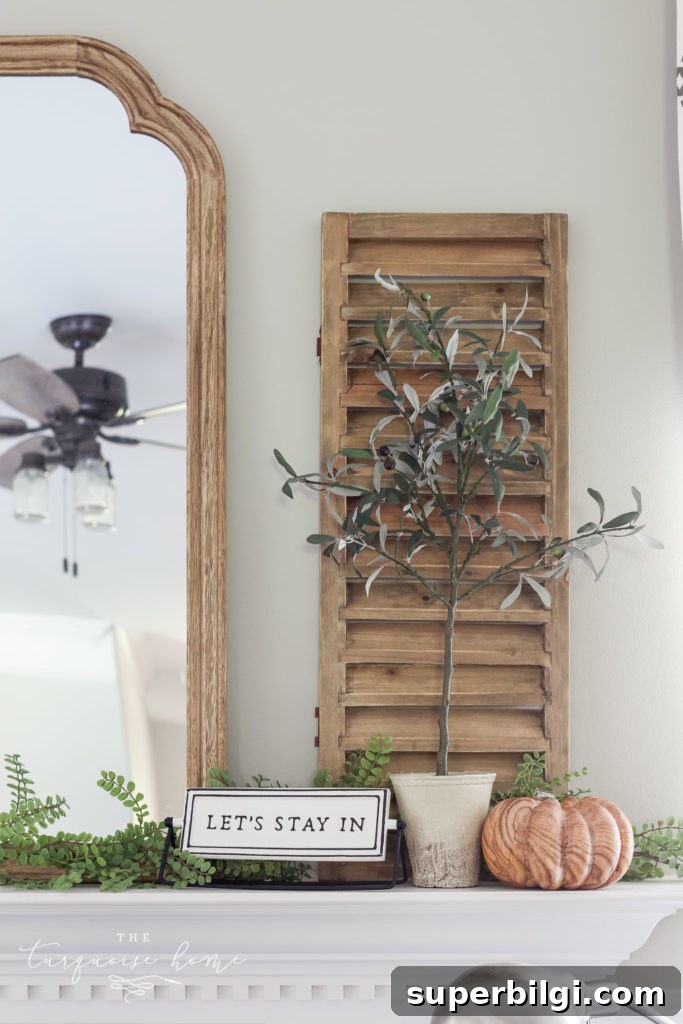 Neutral Fall Mantel Ideas for a Cozy, Timeless Look 8 Shutter and olive tree with