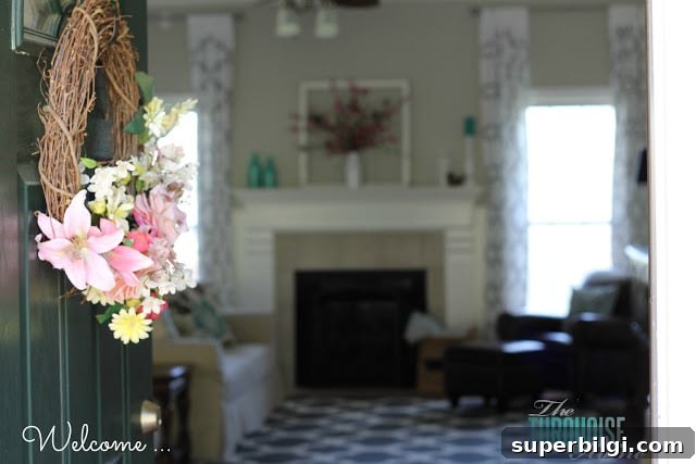 Living Room Makeover Final Reveal: Stunning Before and After 2 Gorgeous Living Room Makeover with beautiful DIY board and batten, Pottery Barn sofa, stenciled curtains, warm wood and pops of turquoise!
