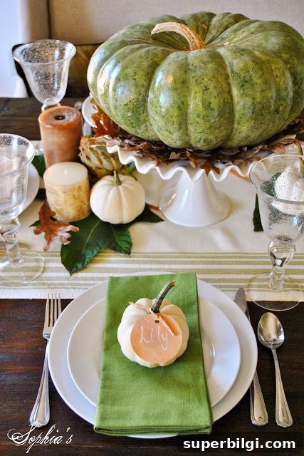 Thanksgiving Table Decorating Ideas for a Memorable Dinner 8 elevated pumpkin in the center of a thanksgiving tablescape