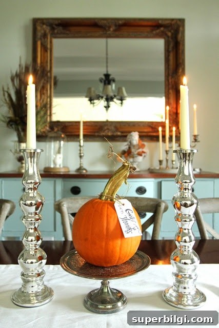 Thanksgiving Table Decorating Ideas for a Memorable Dinner 19 use large silver candlesticks for thanksgiving table decor