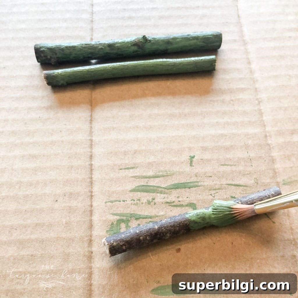 Painting the twigs green for the twig tree ornament